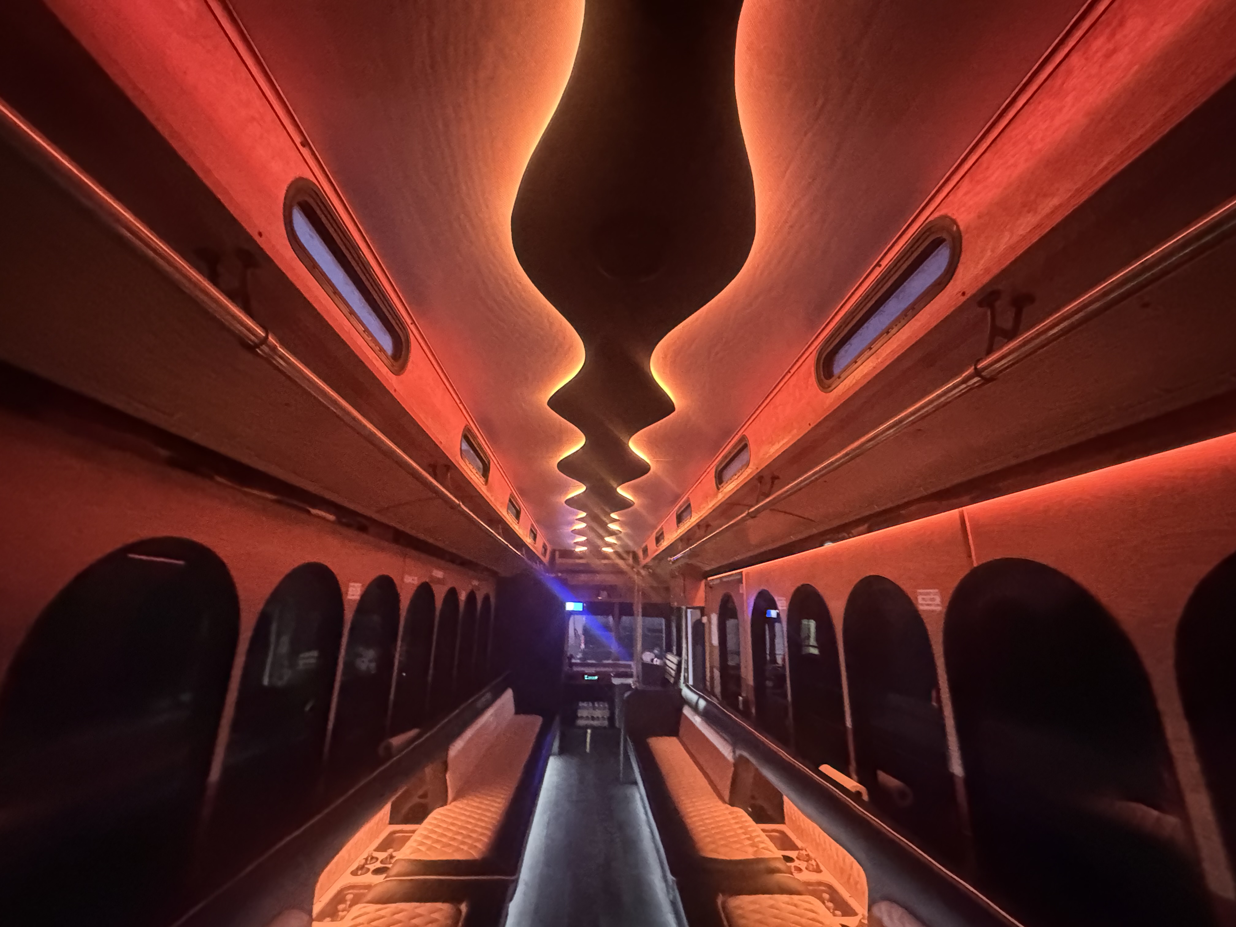 Luxury party bus interior with red LED lighting